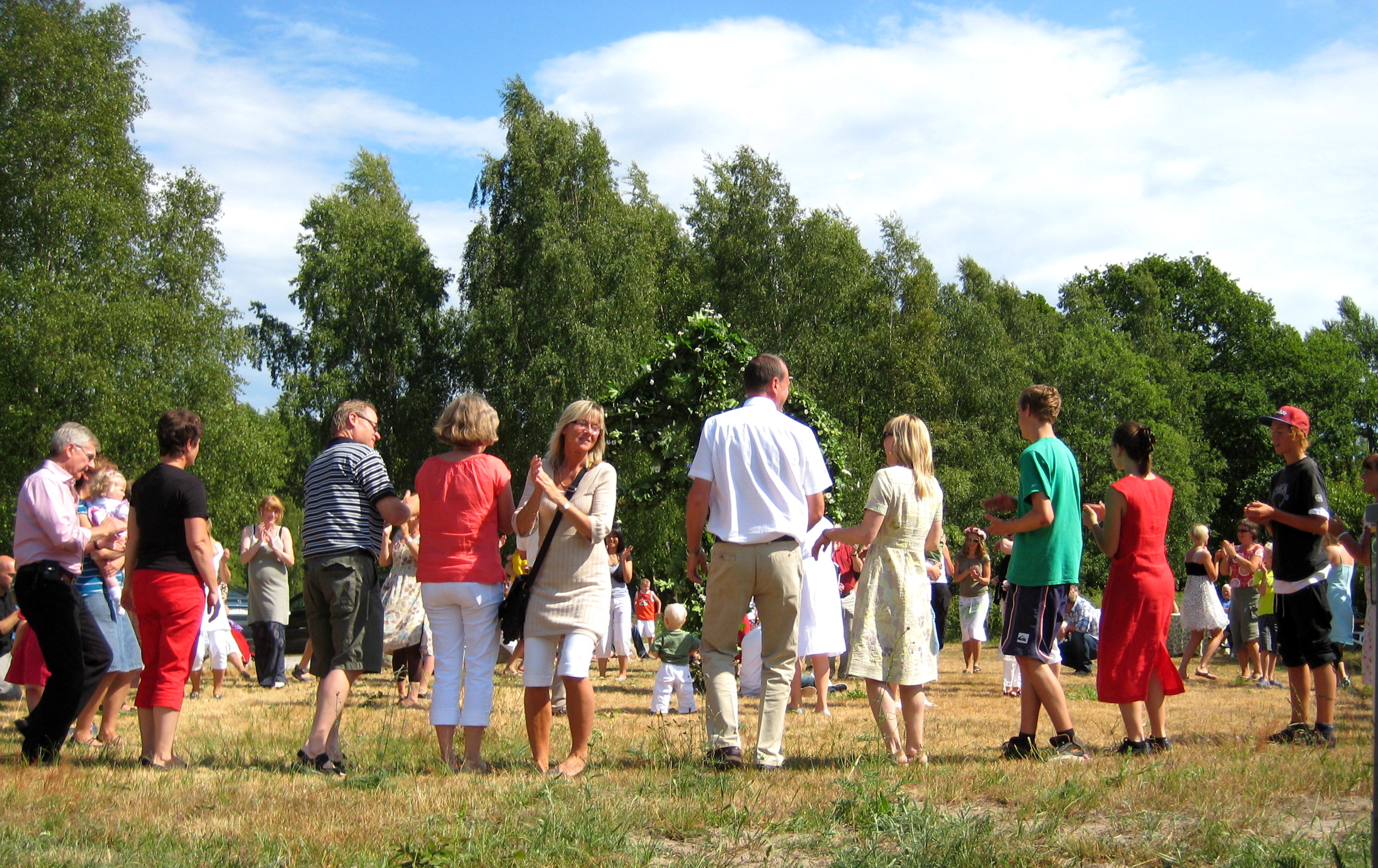 Old and very young dance around the maypole